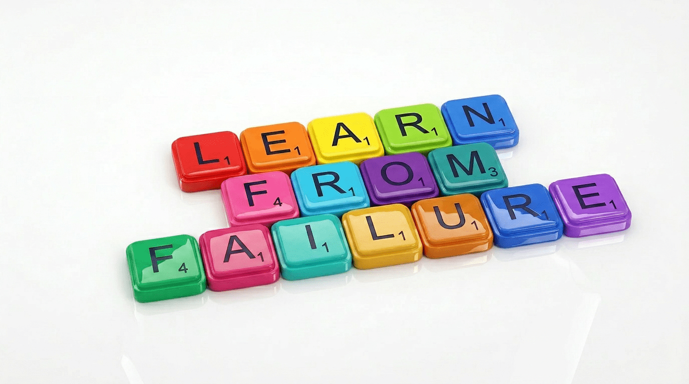 Colourful Scrabble tiles spelling "Learn From Failure", representing the creative value of embracing mistakes in the design process